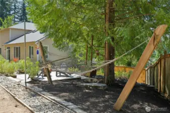 There are multiple spaces on the large lot for relaxation and hobbies.