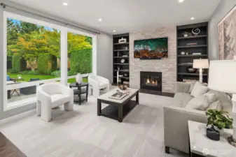 Gather in the bright and welcoming family room, where walls of windows frame views of the lush, manicured backyard and an open flow to the kitchen creates the perfect setting for everyday living and effortless entertaining.