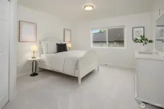 Upper level bedroom #2. All the bedroom closets feature custom closet systems for easy organization.