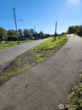The walking/biking trail is right across the street from this lot.