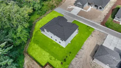 Grass has been virtually added to photo. Sod has now been installed.