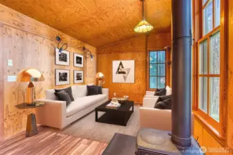 Living room with wood burning stove and views of the sound.