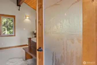 Beautiful custom glass on French Door leading into Primary Bedroom