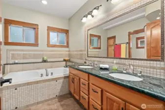 enjoy all 3 soaking jetted bathtubs. Large dual sink vanity with granite slab counters