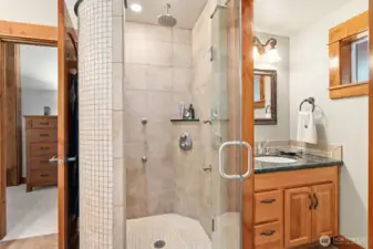 Enjoy the full tile walk in shower with multi shower heads and 3rd sink