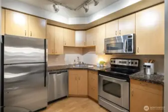 Kitchen stainless steel appliances stay with the condo.