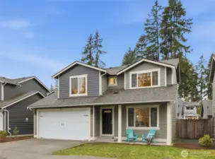 Come sit under the covered front porch and call this home.