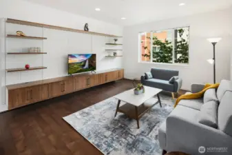 Living Room features a built-in floating entertainment center that can accommodate up to a 100 inch TV.