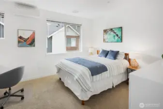 Second bedroom has two windows and room for multiple uses.