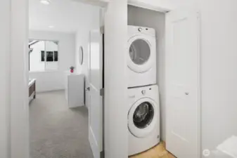 Laundry conveniently located on the upper floor.