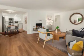 The living room flows seamlessly into the dining room and kitchen.