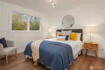 The second bedroom on the main floor with new paint, LVP flooring and a nice sized closet.