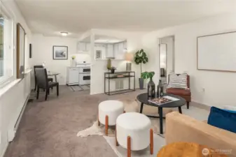 The over-the-garage ADU is spacious and bright with a large living room and separate bedroom.