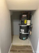 Hot water heater w/storage located under stairs