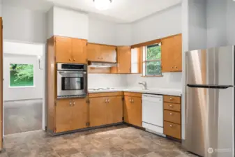 Large kitchen has room for all to congregate. Ample cabinet storage, brand new fridge and lighting sets the stage for dine in or take out.