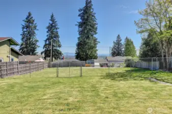 fenced backyard with mountain views