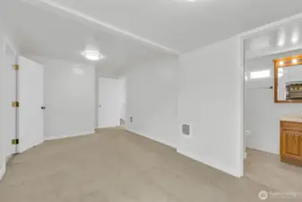 Primary bedroom with 3/4 bath and access to mud room