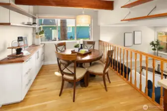 The breakfast nook overlooks the family room. More great built-in cabinets and open shelving complete the eating area.