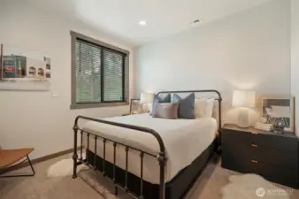Downstairs bedroom for whoever likes to be away from the "crowd" when they sleep - there's a full bath on this floor as well,