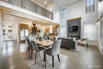 Soaring ceiling with ceiling fan and transom windows.