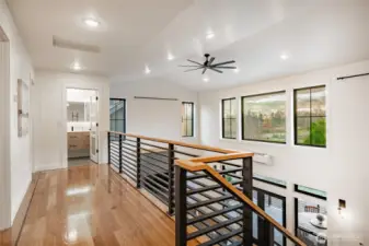 Custom White Oak hardwood floor with Walnut border throughout second level (tile flooring in bath).