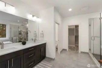 Primary looking into custom walk in closet.