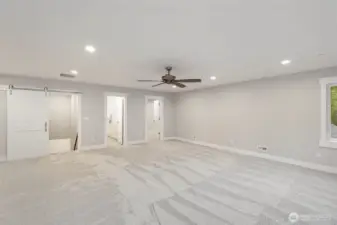 Recreation room looking back at upstairs bath and bonus room.