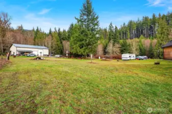 large backyard with an impressive shop