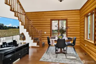 Handcrafted hardwood stair railings and windows with an amazing view at your dining table