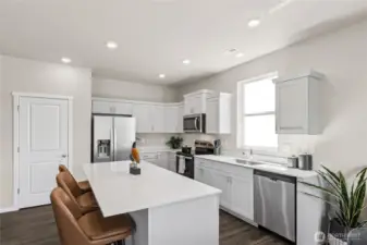 Deep undermount sink and included stainless-steel dishwasher in kitchen makes dishes a breeze. Actual home is under construction. Colors, materials, and features may vary. See site agent for details.