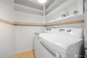 Laundry is conveniently located opposite the kitchen, for those gifted with multitasking.