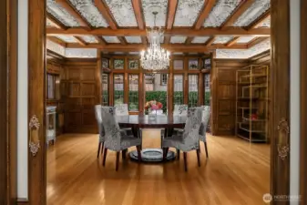 The dining room can easily accomodate a dinner for 20. The room features Siberian Oak paneling, a plaster ceiling and a resored late 1800's French chandelier.