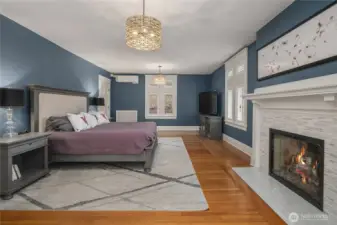 The primary bedroom suite is a true oasis. Measuring approxiamtely 15 feet by 23 feet, the suite features a gas fireplace, a 5 piece bathroom, a custom closet (approximately 11 feet by 16 feet) and a rooftop deck over the main floor sitting room.