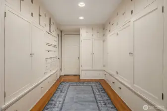 The primary suite walk-in closet (approximately 11 feet by 16 feet).