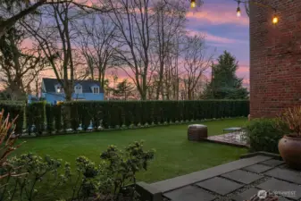 The lawn area extends along the entire West side of the property. The low maintenance turf lawn never needs mowing!