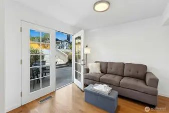 French doors lead to the multi-level patio and back yard.