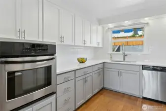 Remodeled kitchen with quartz counters, new cabinets and stainless appliances.