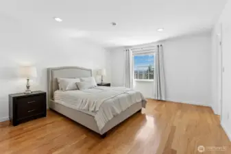 Primary suite has partial lake and mountain views.