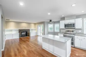 Kitchen with eating nook and family room and access to rear covered deck.