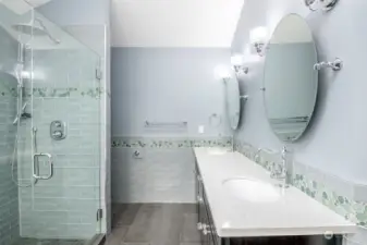 Primary bath with quartz countertops.