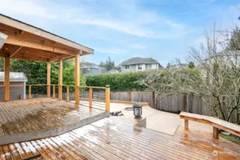 Huge covered deck and fully fenced rear yard. Mature plantings creates privacy screen.