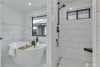 Primary Bath w/soaking tub and private shower featuring dual sprays