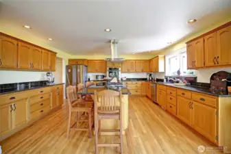 Chef's kitchen with 5 burner Wolf gas cooktop...