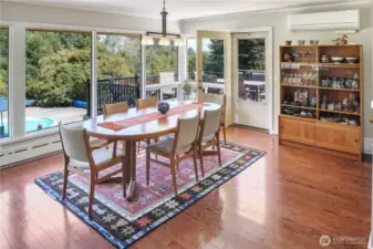 You will never tire of the views from the main level of this MCM home. Step outside the door to enjoy your meals al fresco.
