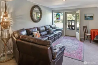 Down a flight of stairs, find yourself in this expansive second living room, rec room, tv room – whatever your heart desires. Maybe turn the lower level into a multi-gen living area. The options are practically endless. Right outside is the lower patio with access to your new hot tub, pool and lush established gardens.