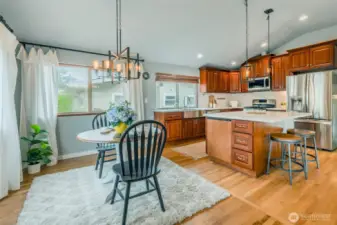 The updated Kitchen features a large island that is perfect for informal mealtimes, while the expansive dining area is available for larger or more formal settings. A great entertaining space!