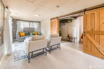 Flow through the pantry/laundry space barn doors to the great room downstairs...