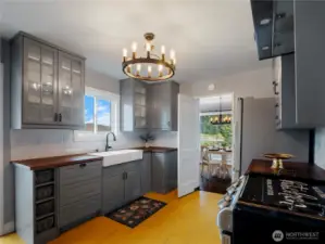 Beautiful chandelier and farmhouse sink