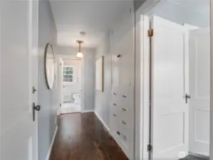 Hallway to basement, primary and hallway bath