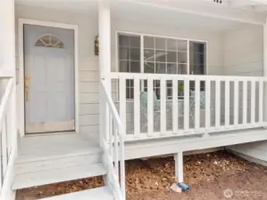 Covered front porch for quiet rainy days.